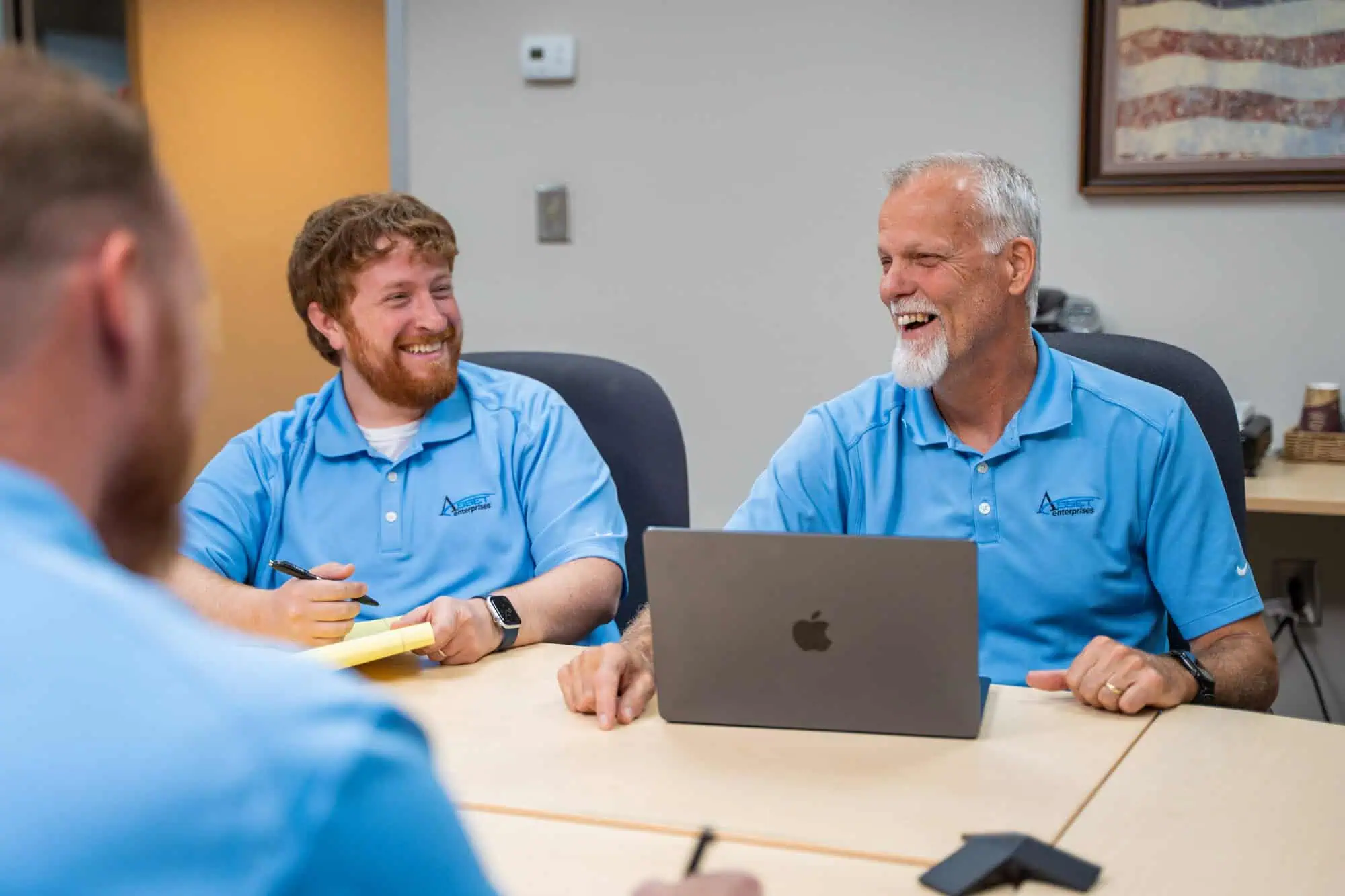 Team members discussing services deployment, ensuring your equipment arrives fully prepared from our warehouse.