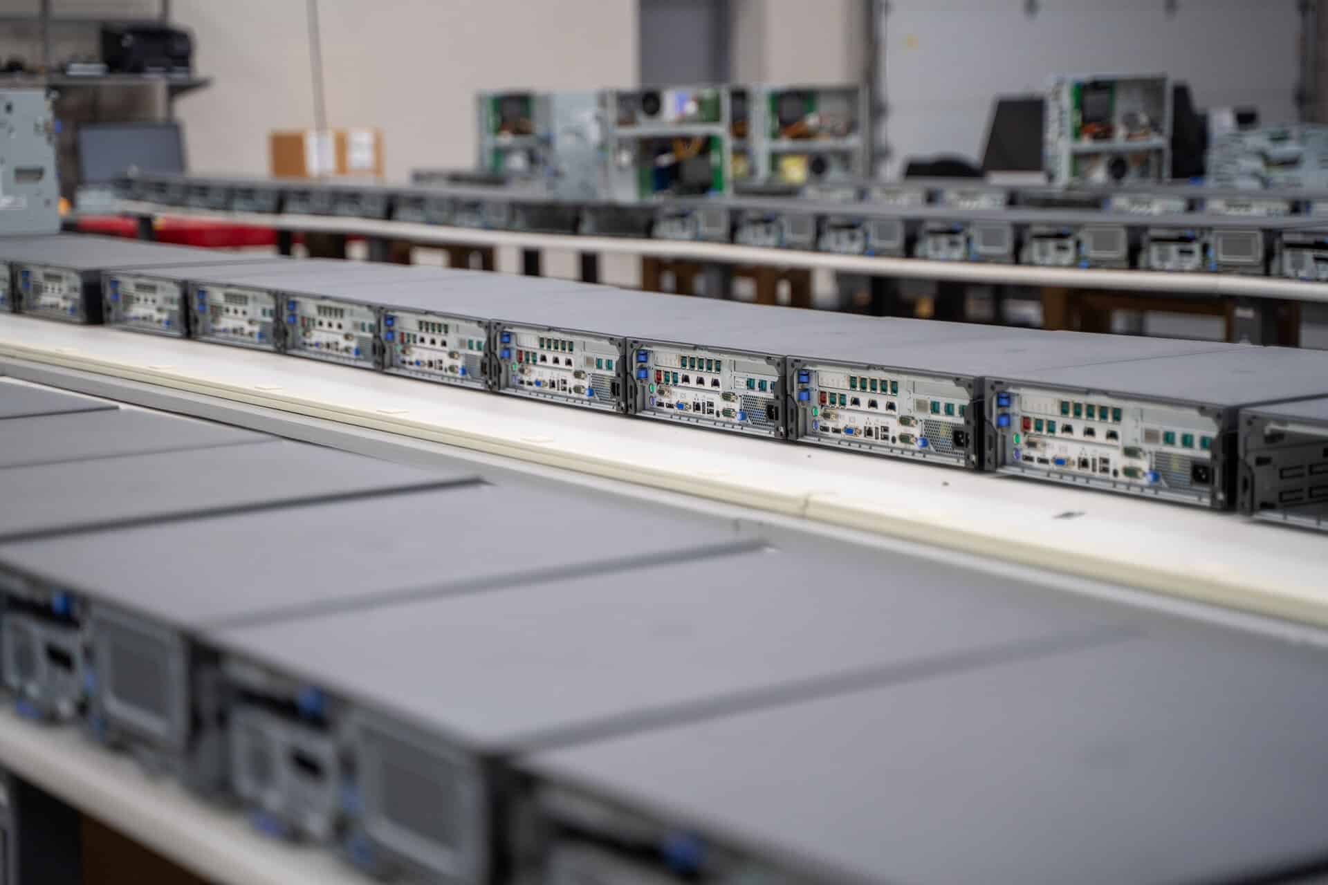 Rows of server racks in a warehouse, illustrating asset integration within sourcing logistics.