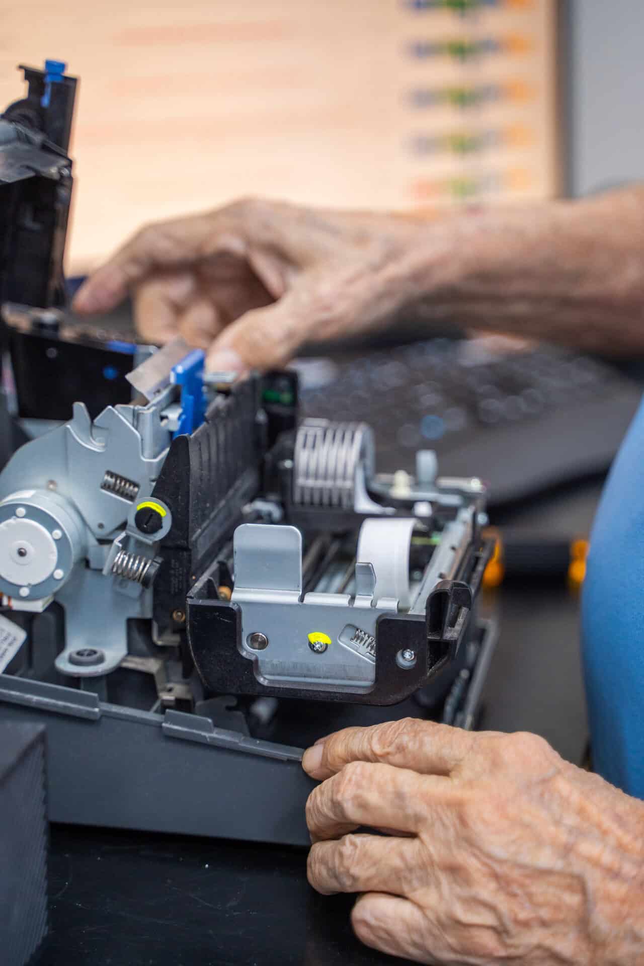 Technician refurbishes and repairs printer, extending your technology lifespan and protecting your investment.