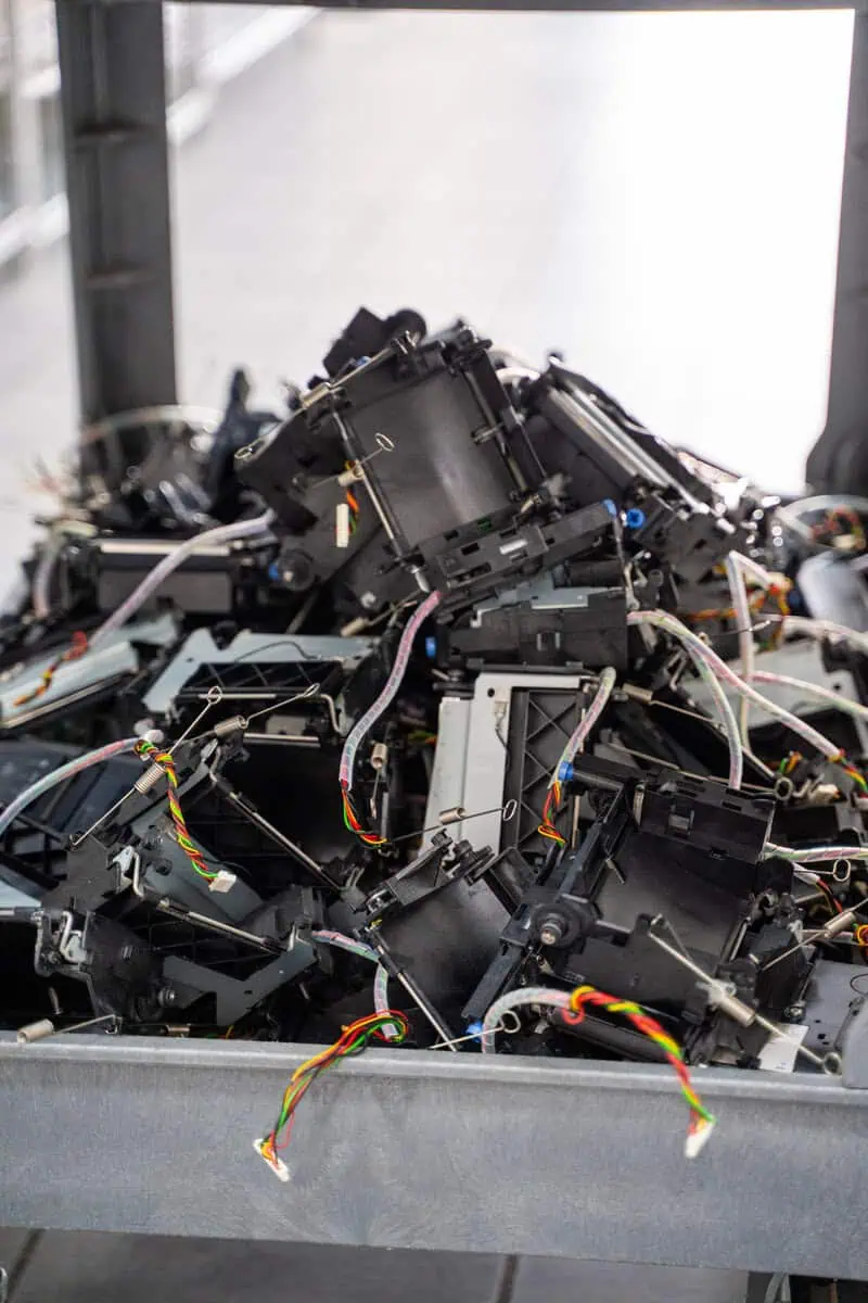 Pile of electronic parts in a warehouse setting, emphasizing parts logistics and warehousing efficiency.