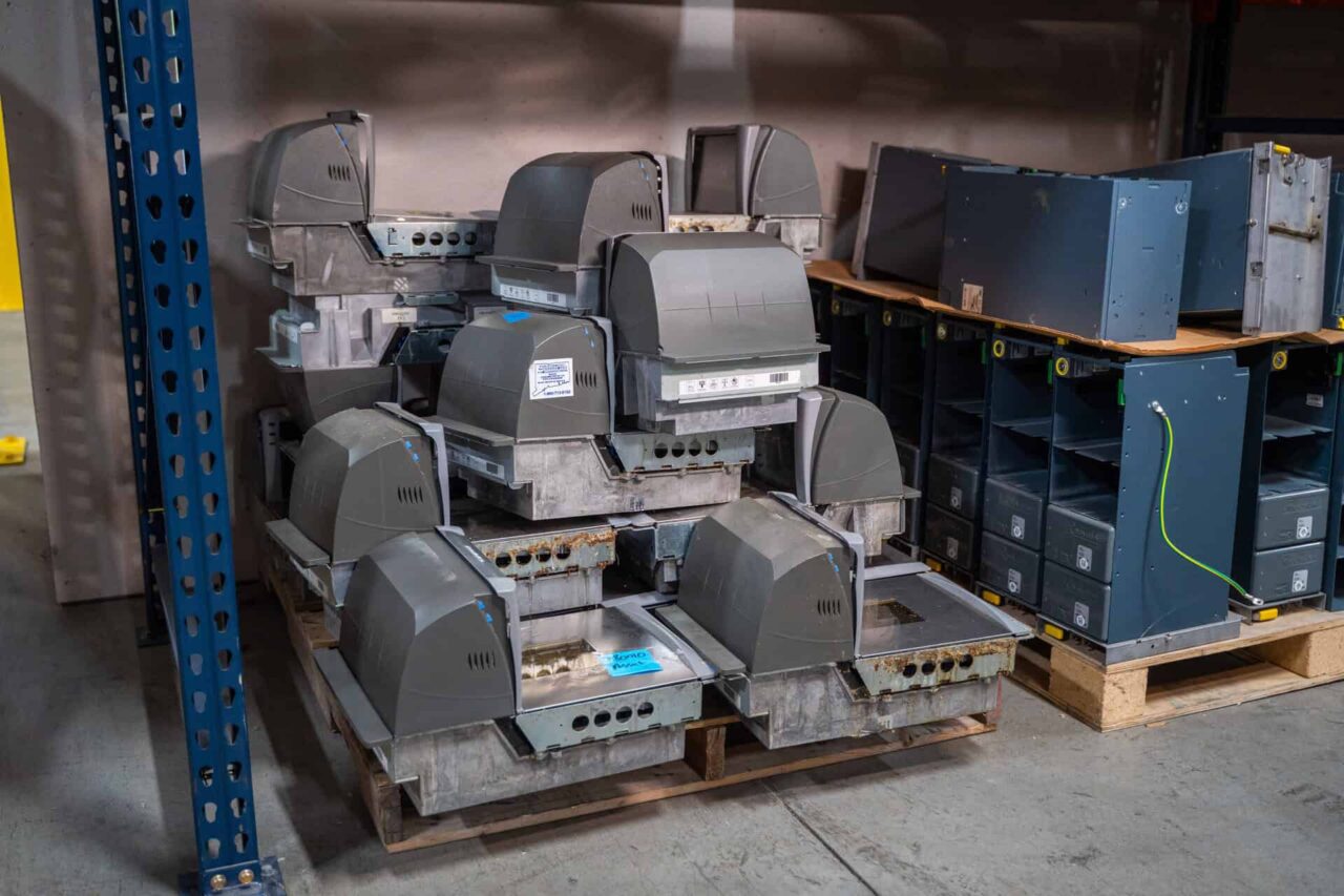 Stacked industrial hardware units in a storage area, representing our trusted suppliers and strong partnerships.